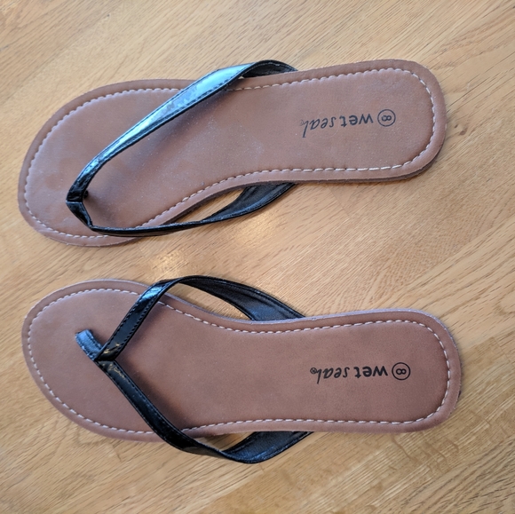 Wet Seal Shoes - Wet Seal flip flops. Size 8. Black
